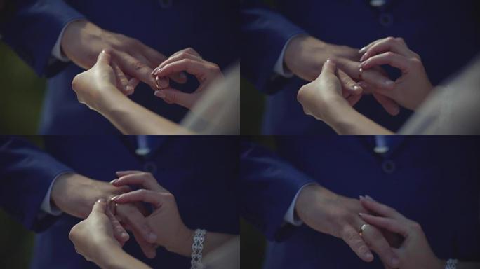 新娘把戒指戴在新郎的手指上