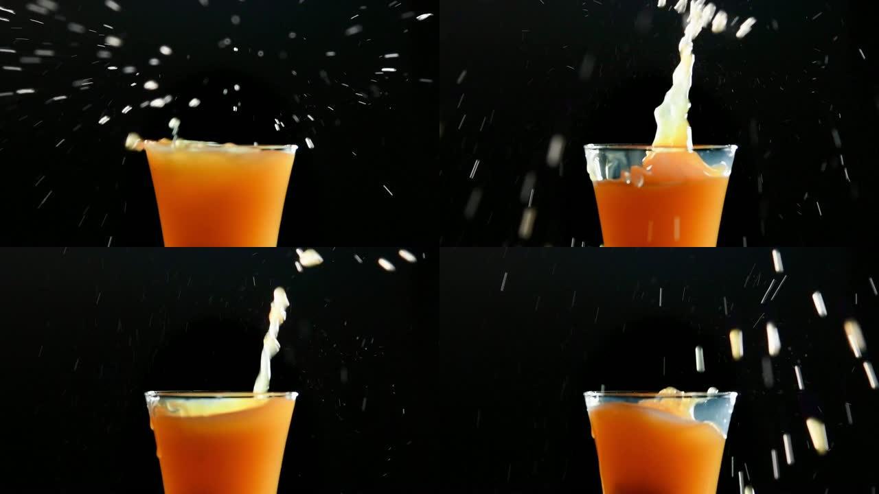 黑色背景下的橙汁飞溅