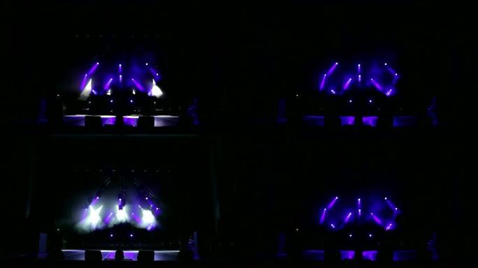 空荡荡的剧院里的紫光和白光。舞台灯光背景。