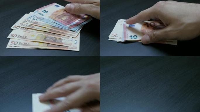 手工从桌子上取下大量欧盟货币批次4K 3840X2160超高清视频-一叠欧元纸币采用4K 2160p