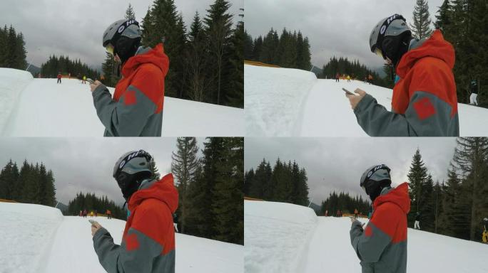 滑雪板与智能手机在滑雪场。