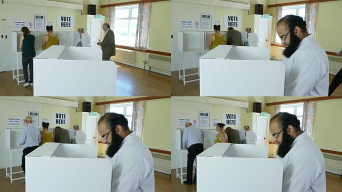 4K:巴基斯坦男子在投票站投票站投票。选举