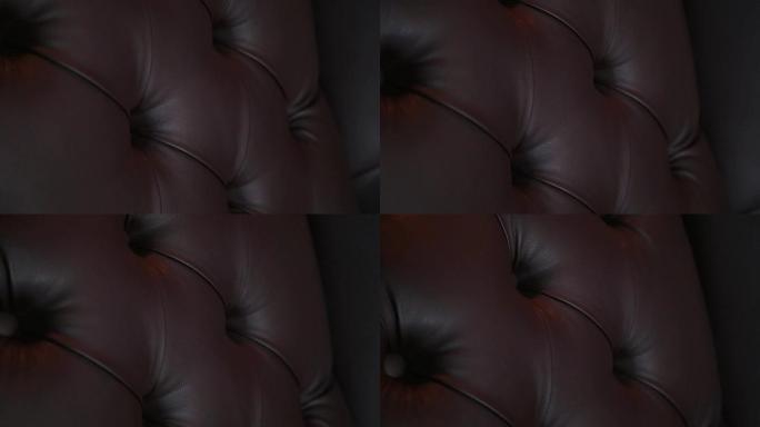 优雅的饱和光泽金色皮革纹理沙发椅，棕色皮革背景