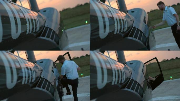 飞行员进入直升机驾驶舱