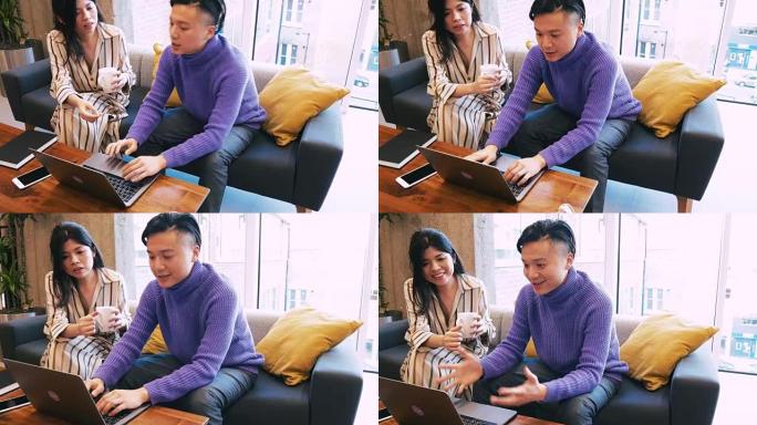 亚洲企业家在笔记本电脑上进行团队合作
