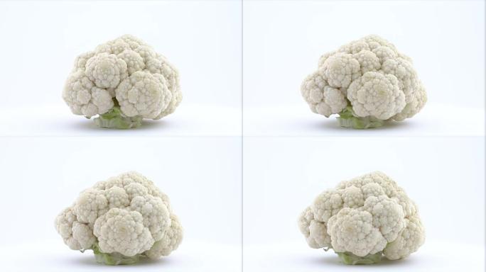 一个完整的迷你白色花椰菜。在转盘上旋转。孤立在白色背景上。特写。宏观。