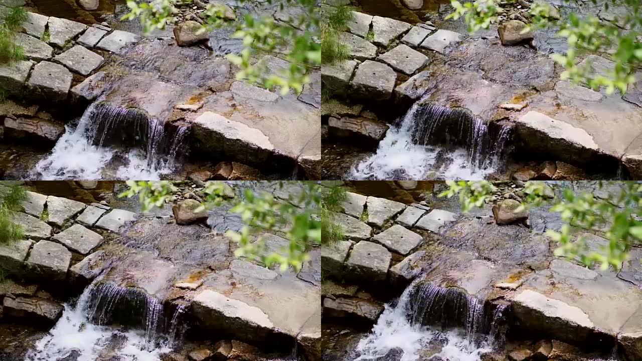 瀑布，高山小溪，河流。干净，干净，饮用水。夏日，在森林里，在山里，在阿尔卑斯山