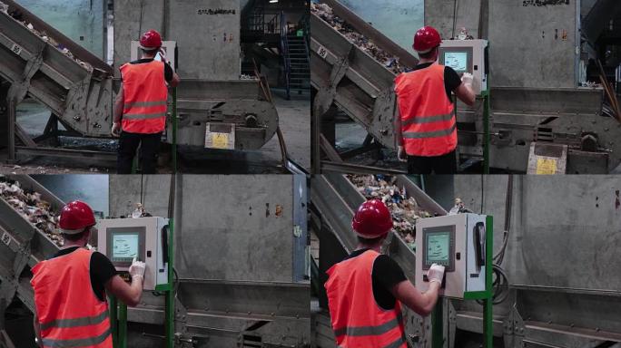 废物处理场的工人在触摸屏上控制传送带速度