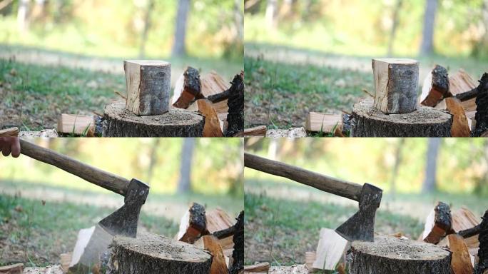 森林人用斧头砍木头的慢动作镜头