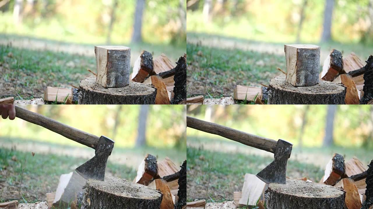 森林人用斧头砍木头的慢动作镜头