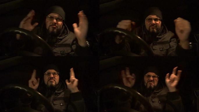 一个男人在黑暗的汽车里跳舞
