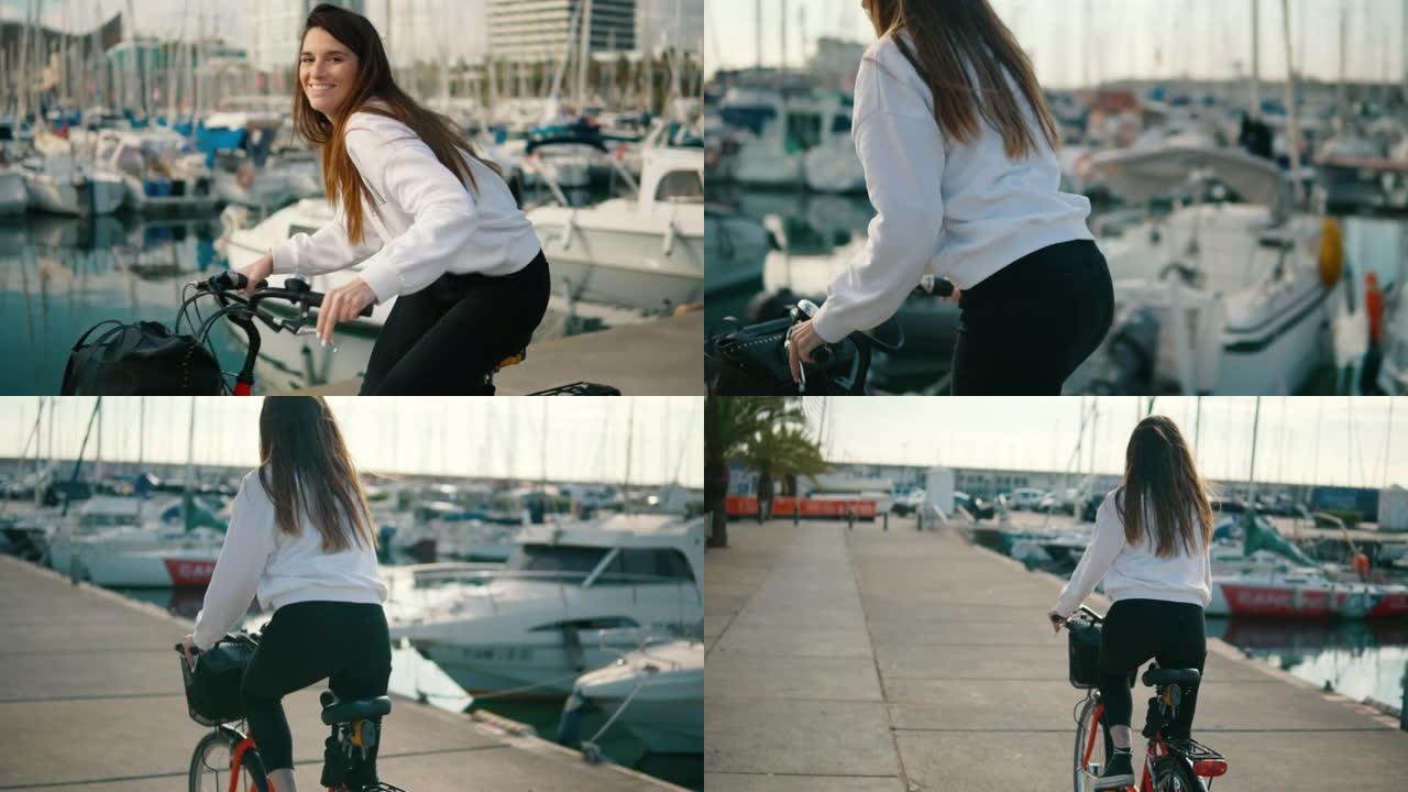 女人在夏天沿着海滩骑自行车