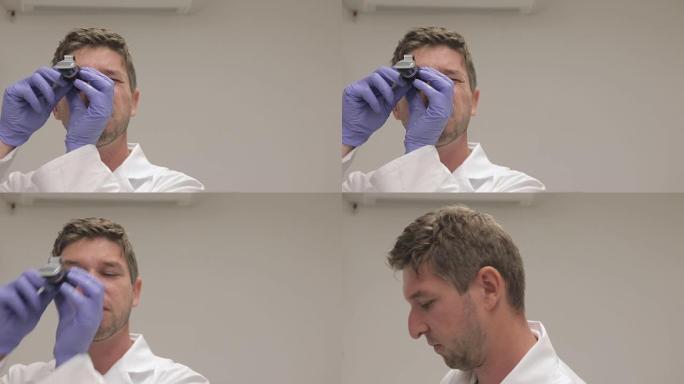 成年男性科学家使用折射仪测量葡萄中的糖含量