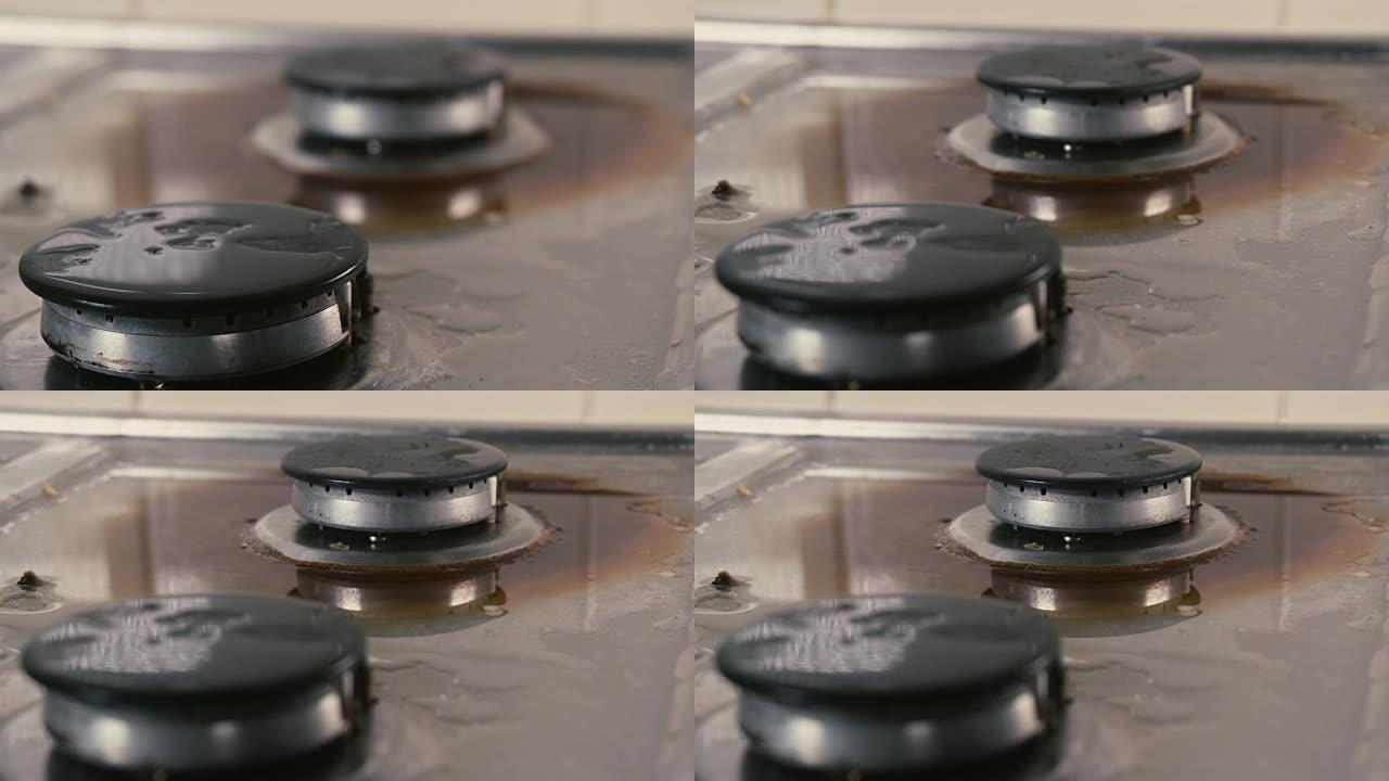 拉脏厨房炉灶的焦点镜头