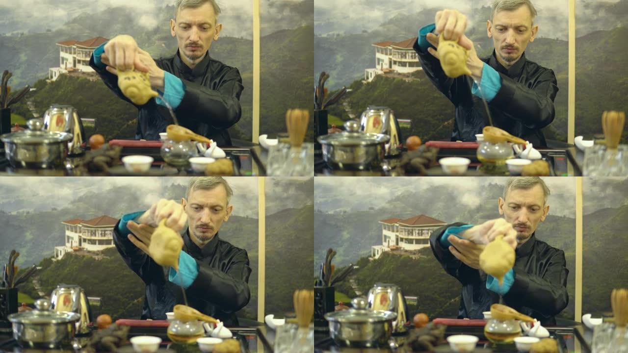 中国传统。男子大师在仪式上泡茶