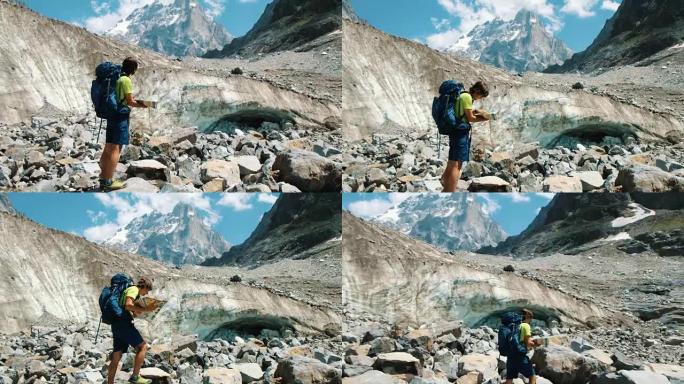 远足者旅行指南一名男子在地图上研究路线，并显示了登山中的方式，相机的运动。