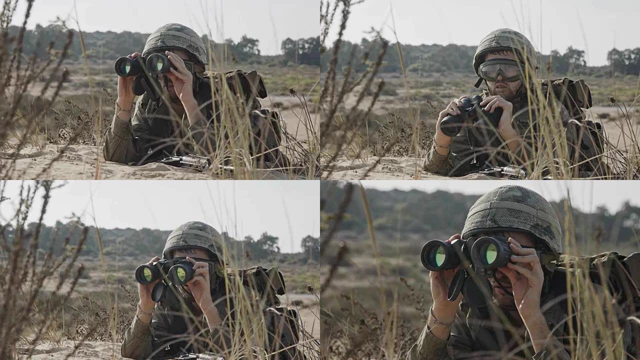 以色列士兵用双筒望远镜发现敌人