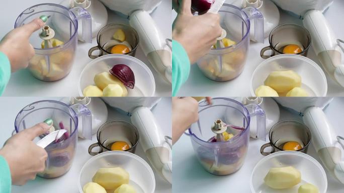 这个女人把西葫芦切成搅拌机，用来研磨蔬菜。容器旁边是土豆和洋葱。玻璃杯里有一个鸡蛋。