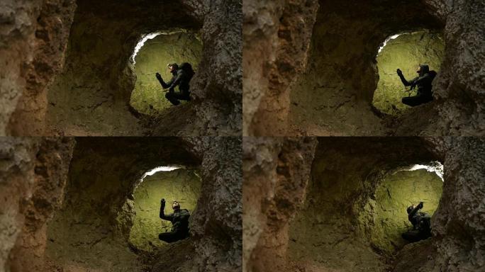 高加索洞穴探险家用手电筒照亮地层岩石。地质研究探险