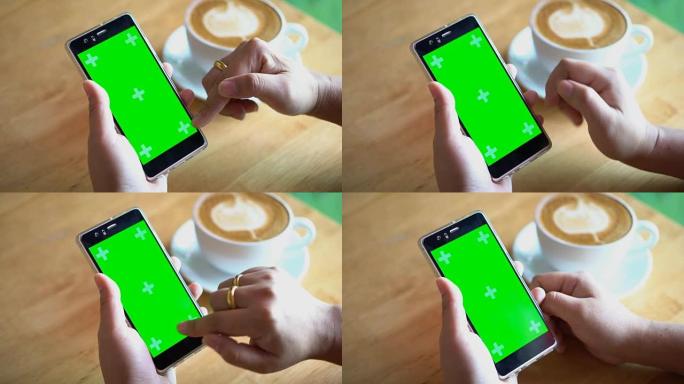 双手使用绿屏显示智能手机