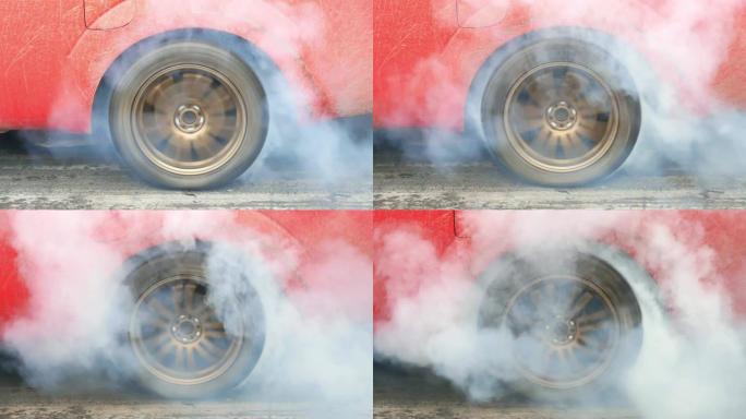 拖拉汽车使轮胎冒烟，赛车将轮胎上的橡胶烧掉，为比赛做准备。