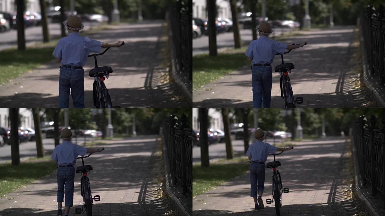 男孩在城里骑自行车走路