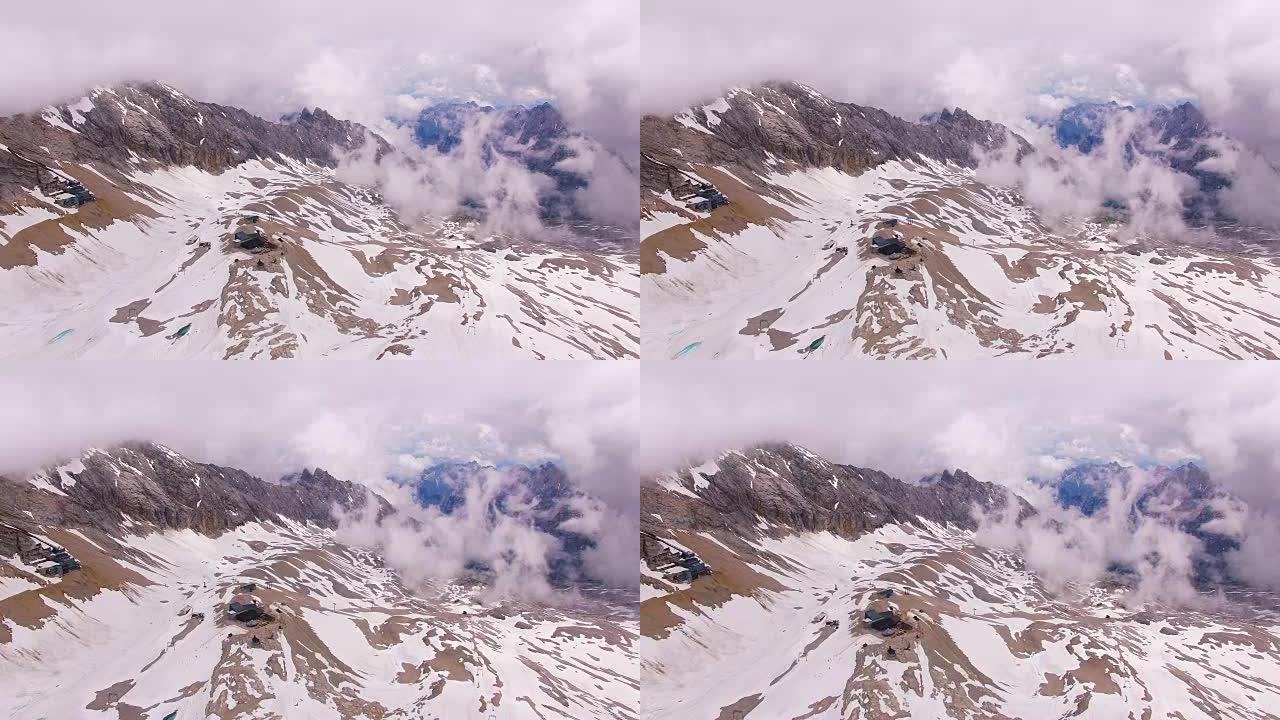 摄像机在2962米的白雪皑皑的楚格峰上空飞行。德国巴伐利亚州。