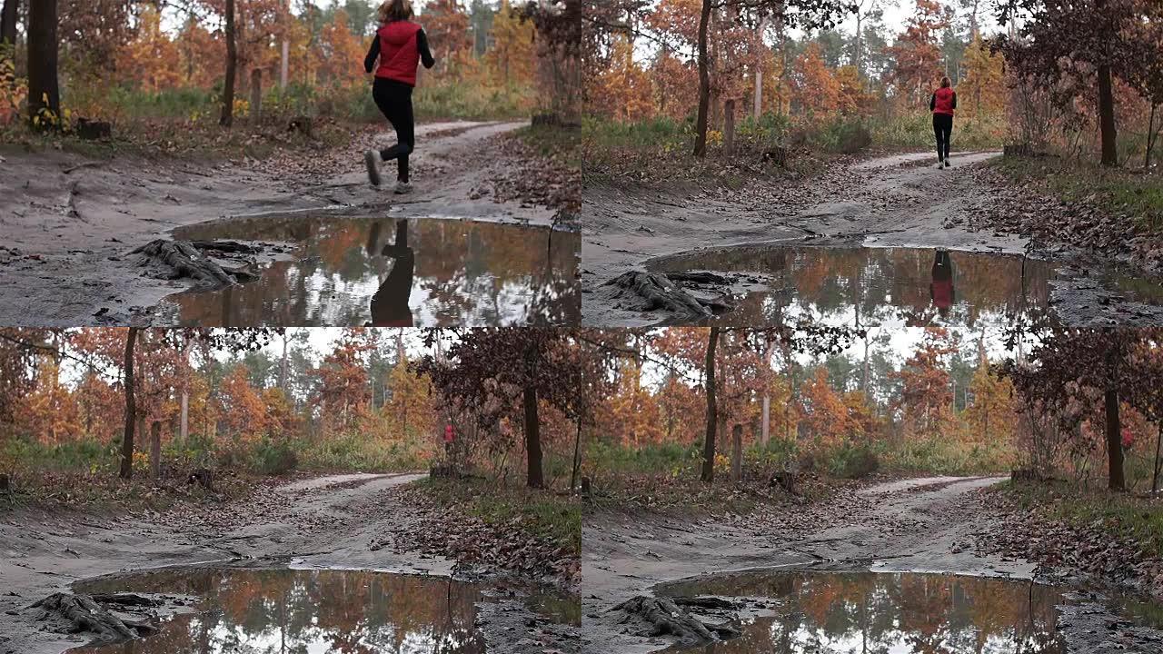 做运动。一个女人沿着马路踩进水坑。