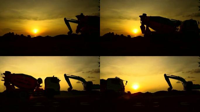施工现场的施工视频剪影挖掘机正在挖掘地面并举起大型砂浆，工程和建筑工人将为五彩缤纷的日落提供帮助。
