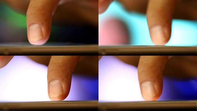 男子用手指触摸智能手机