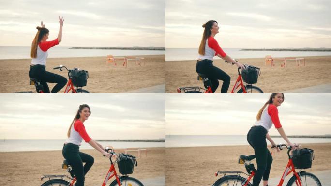女人在夏天沿着沙滩骑自行车