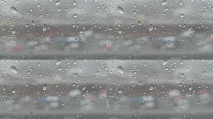 窗户和交通背景上的雨滴。