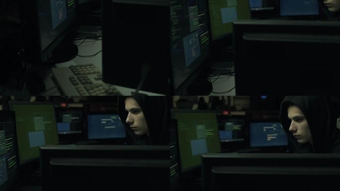 黑客在黑暗的地下室与他的计算机连接