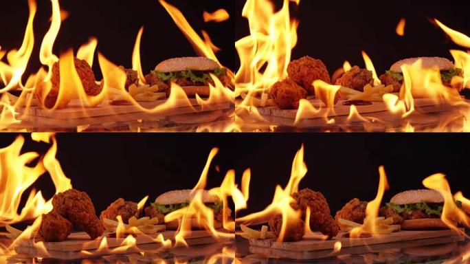 汉堡和鸡肉快餐火慢动作背景。