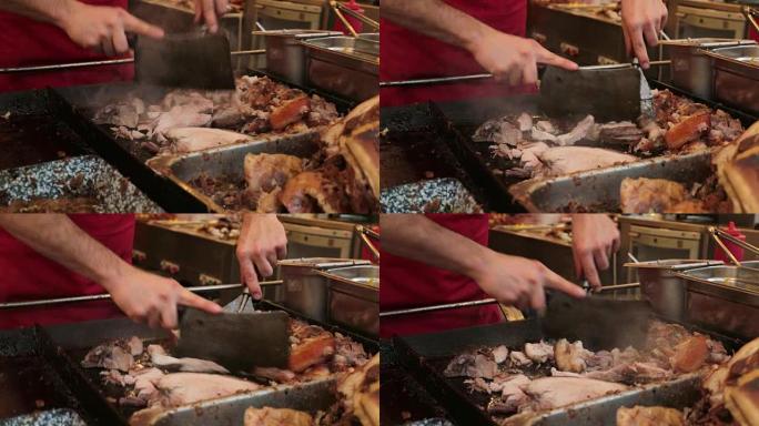 屠夫用大刀割肉。在食品市场上，人手切片和切肉分类的特写镜头