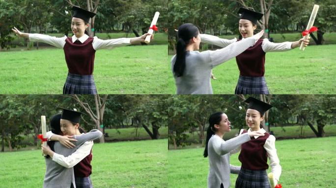 年轻的亚洲女毕业生在毕业典礼上拥抱她的朋友。国际多样性背景