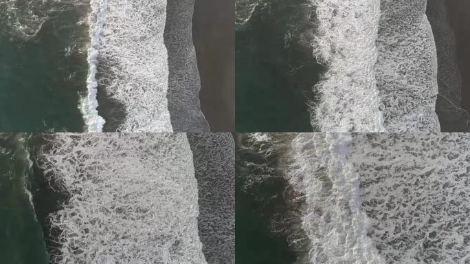 印尼沙滩上泡沫波破裂的无人机镜头