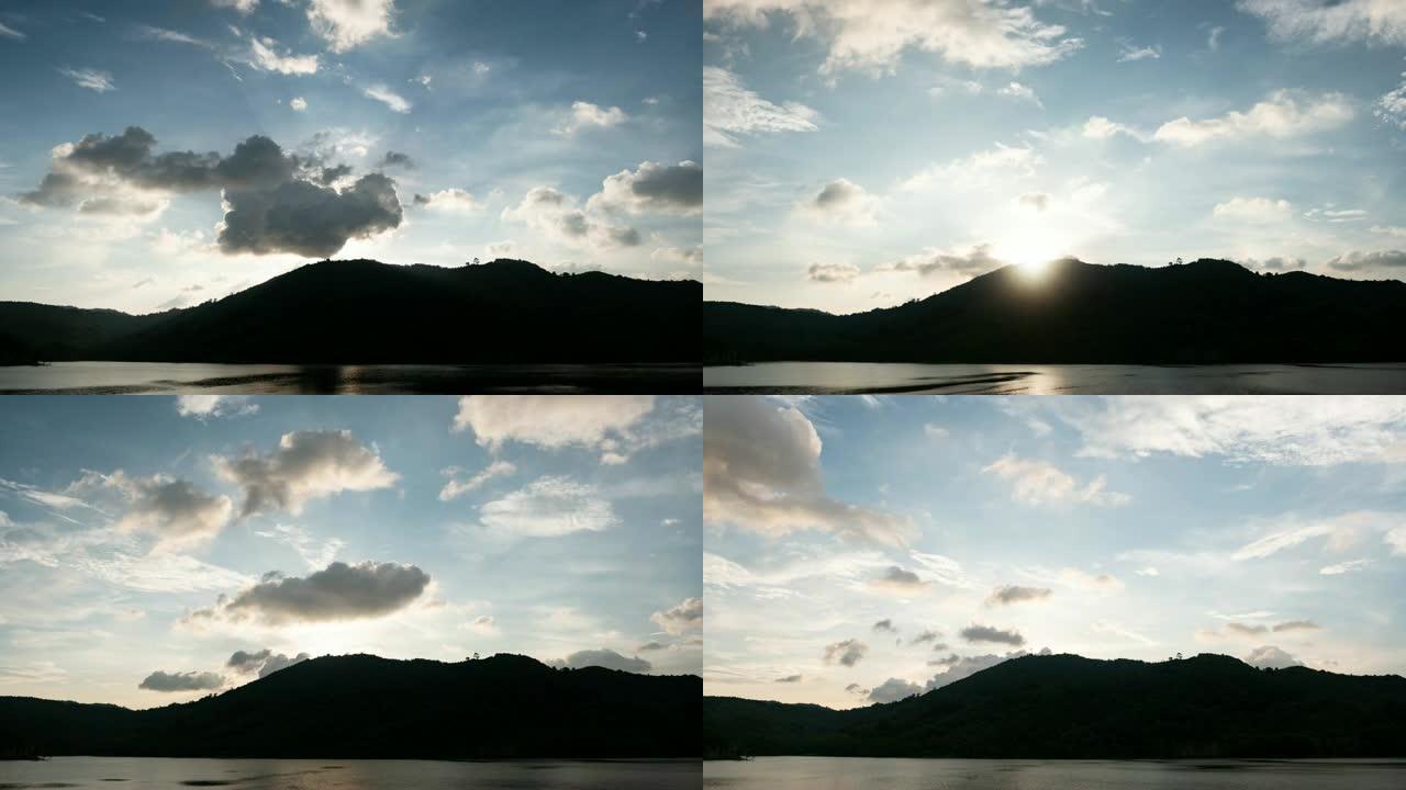 4k-时间流逝美丽的自然阳光日出或日落天空和云在泰国普吉岛热带雨林上快速移动