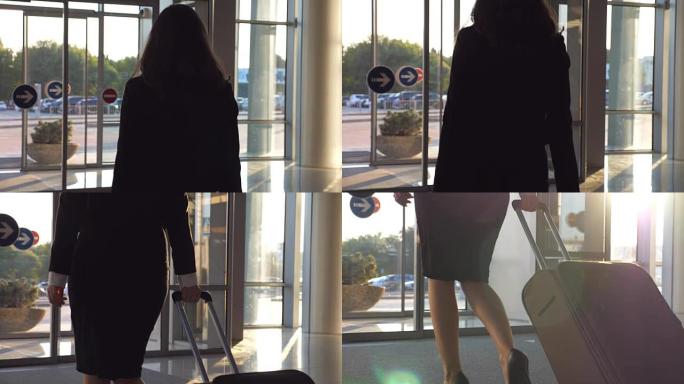 穿着高跟鞋的年轻女子带着手提箱沿着机场大厅或候机室行走。跟着商务小姐带着行李从航站楼出来。旅行或度假