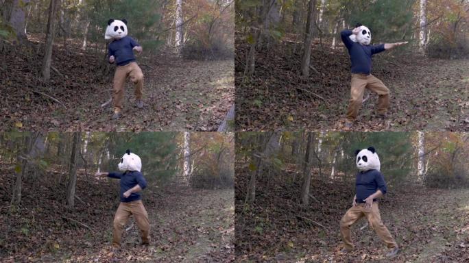 戴着熊猫头面具的男子在公园外面跳舞庆祝