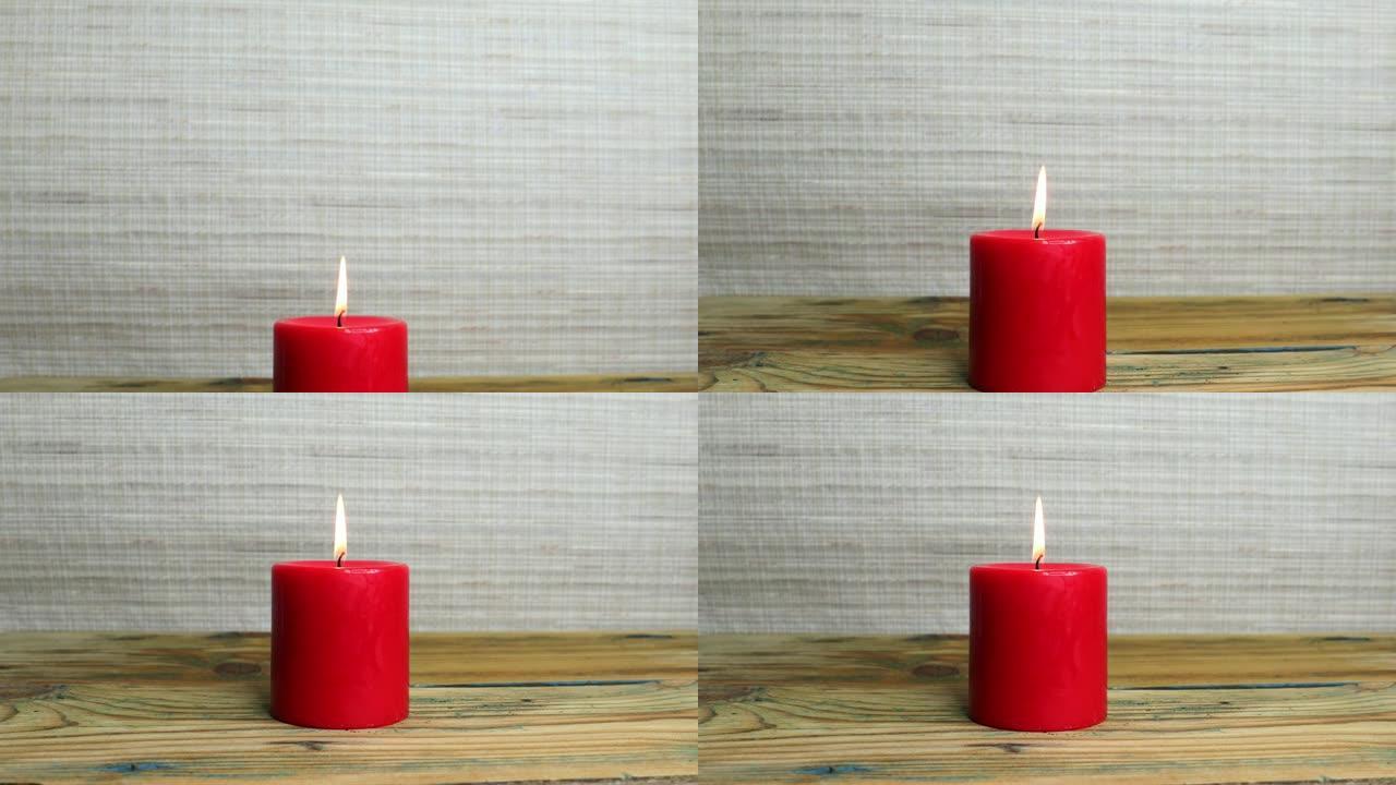 木桌上的红色蜡烛