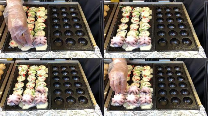 在日本用大鱿鱼烹饪球形食物饺子油炸小吃。这种食物的日语名称 “章鱼烧”。第5部分
