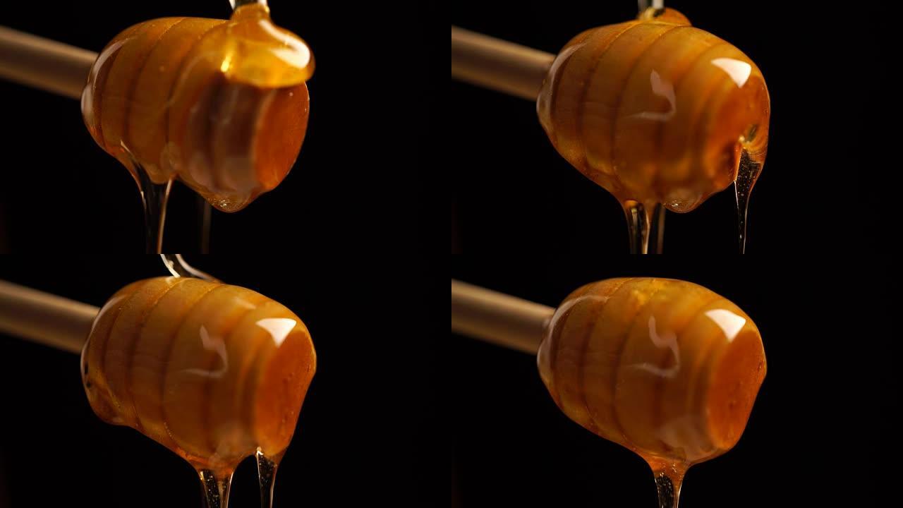 从木制蜜勺中滴下的有机蜂蜜素材背景