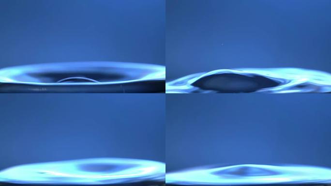 水滴溅入平静的水中-超级慢动作