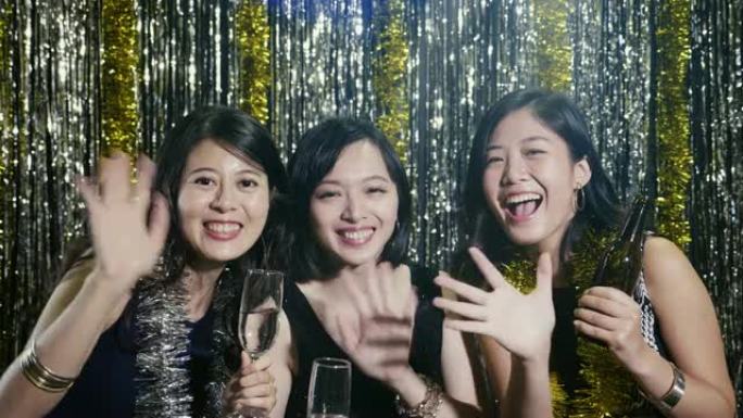 亚洲女性面对镜头微笑地挥手