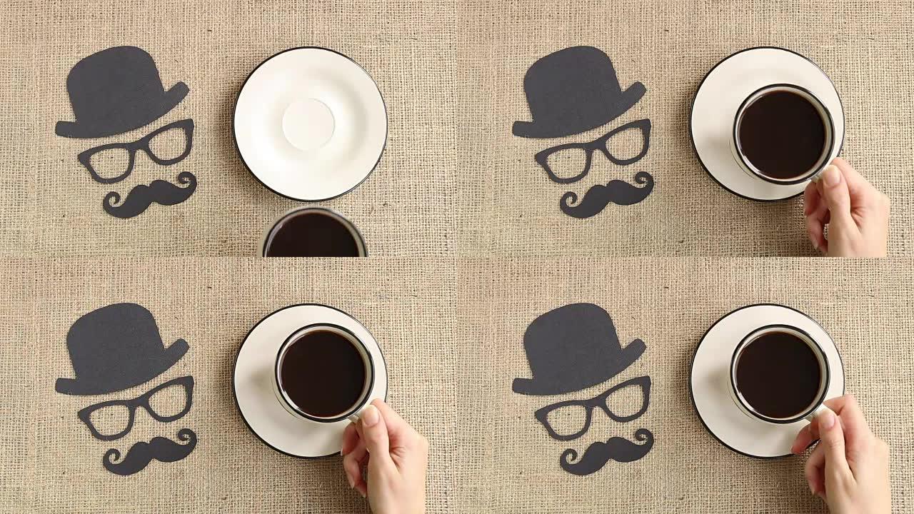粗麻布背景上带有胡须，眼镜和帽子的男性轮廓图案，带有一杯咖啡。Movember概念。前列腺癌与男性健