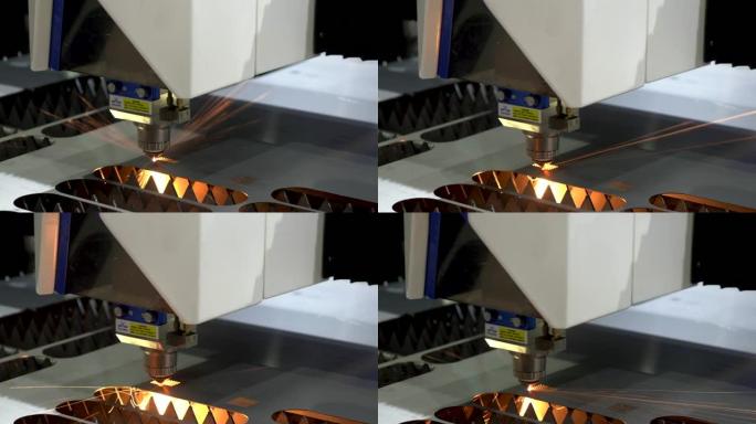 光纤激光切割机用火花灯切割金属板。高科技制造概念。