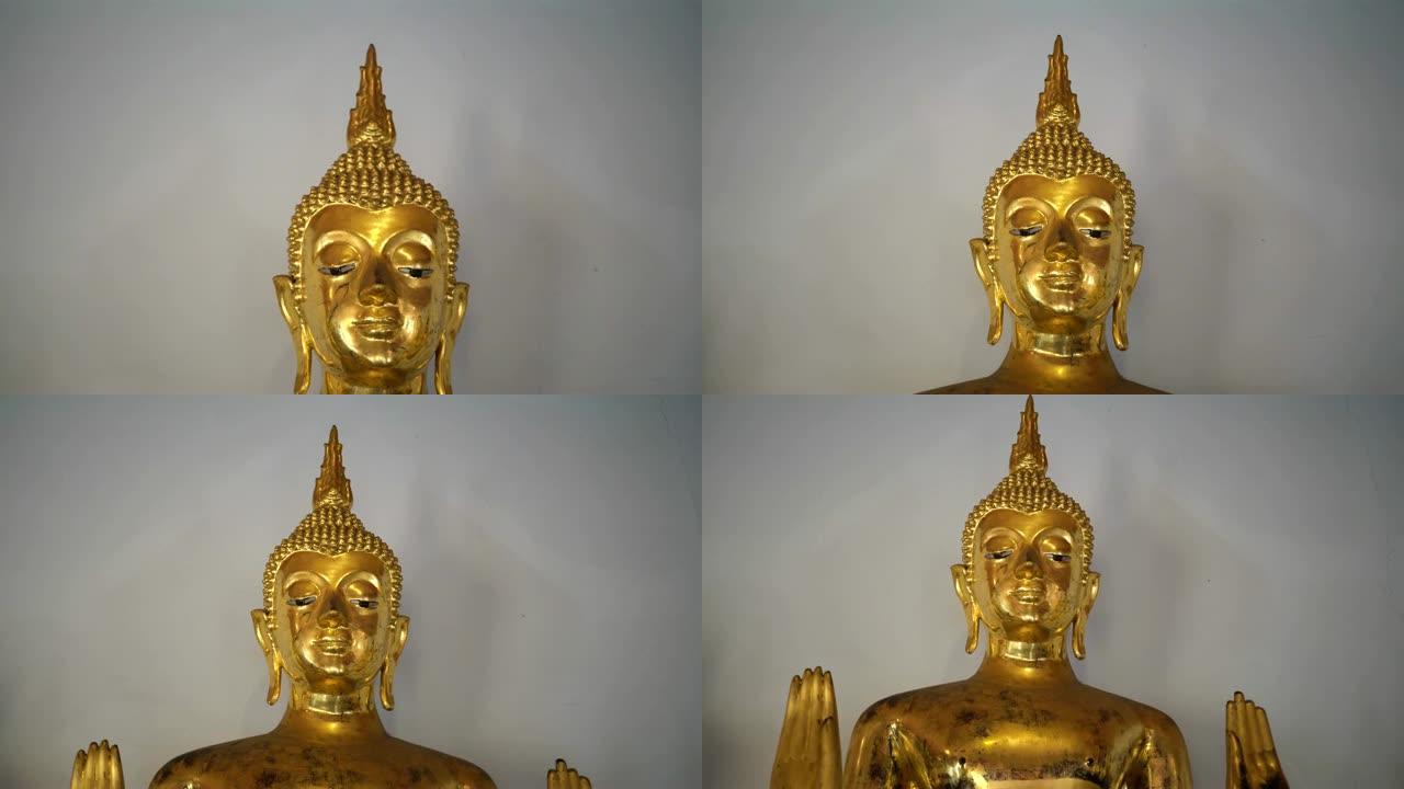 在泰国曼谷市Wat Pho的白色墙壁上拉出金色佛像的镜头