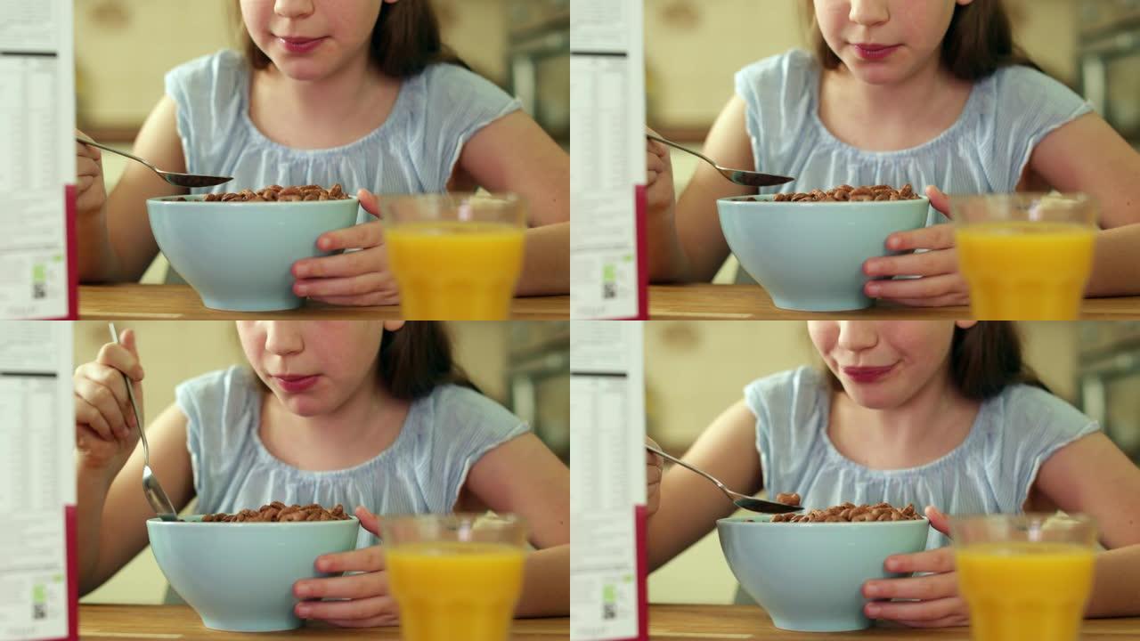 女孩在厨房里吃不健康的一碗含糖早餐麦片的特写