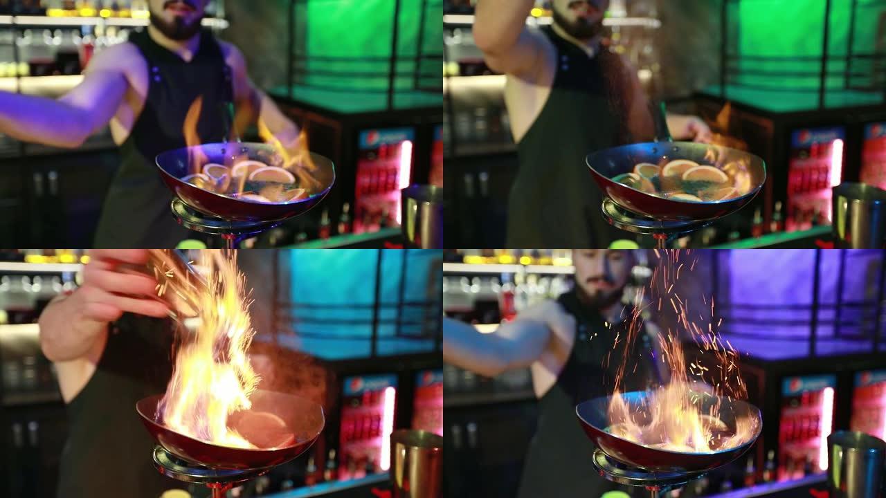 大胡子调酒师将肉桂倒入锅中，橙子放在燃气燃烧器上。